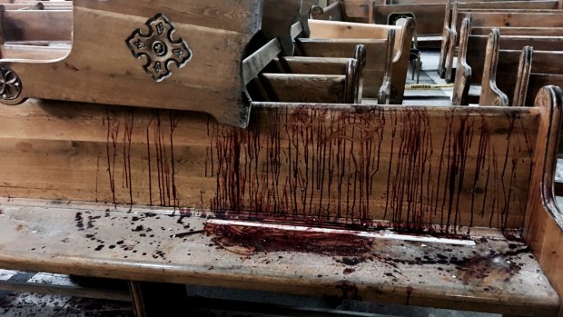 Blood stains pews inside the St.George Church after a suicide bombing in Tanta, Egypt, on Sunday.