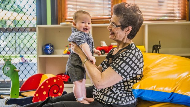 Canberra Mothercraft Society president Viola Kalokerinos with Noah Cool, six months, at the QEII Family Centre on Friday. 