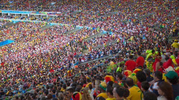Fans at a World Cup football match at Maracana stadium, Rio de Janeiro.