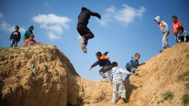 Israeli Bedouin children play before a rally marking the 40th anniversary of Land Day and against a plan to uproot the Negev Desert village of Umm al-Hiran in 2016.