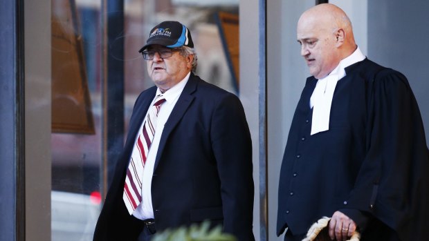 Neil Albert Futcher (left) and his lawyer John Galluzo leaving court in August 2016.