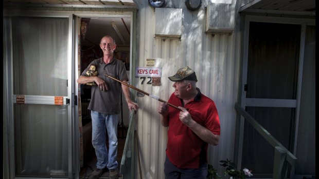 Kevin Marley and neighbour John McGregor who live at the Seaford beach Caravan Park enjoy a laugh at Kevin's cabin.
