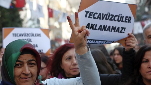 Turkish women hold signs that read "rape cannot be pardonned' in Ankara on Saturday.