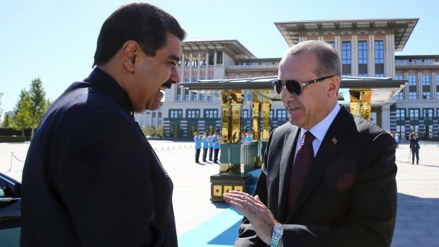 Turkish President Recep Tayyip Erdogan, right, welcomes Venezuelan President Nicolas Maduro at the Presidential Palace in Ankara on Friday.
