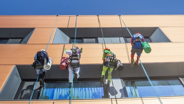 Rope Access Engineering employees dress up to entertain the children at Canberra Hospital.