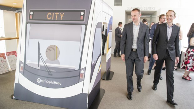 ACT Chief Minister Andrew Barr and Capital Metro Minister Simon Corbell check out a cardboard mock-up of the light rail tram in January. 