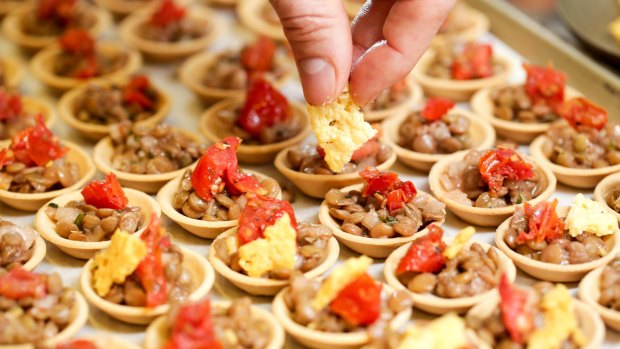 Chef preparing canapes. 