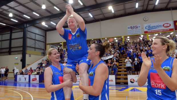 An emotional Kristi Harrower is chaired off the court after her last game for the Spirit on Sunday.
