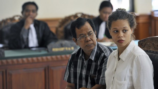 Heather Mack listens while sitting next to an interpreter in a court in Denpasar, Bali. Mack is charged with the premeditated murder of her mother, whose body was found stuffed in a suitcase in Bali last August. 