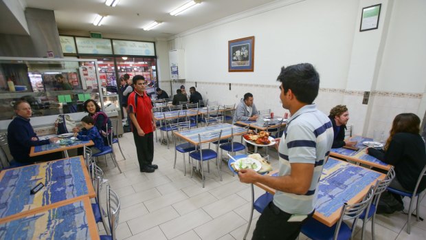 Fluorescent lighting and wipe-down tiles belie the dishes’ authenticity at Faheem Fast Food.