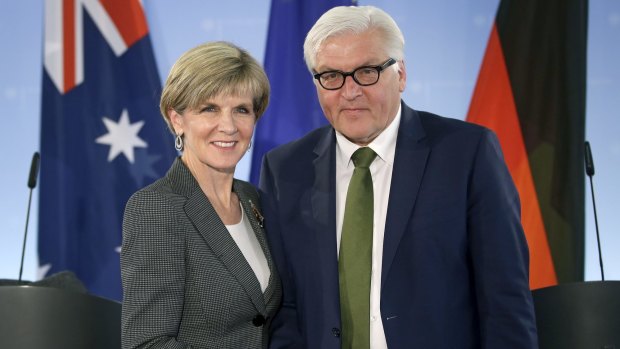 German Foreign Minister Frank-Walter Steinmeier, right, and Julie Bishop, left, shake hands after a joint press conference as part of their meeting in Berlin, Germany.