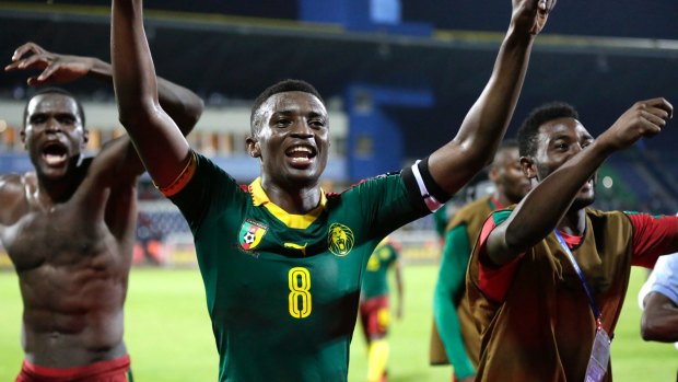 Cameroon's Benjamin Moukandjo celebrate with his teammates.