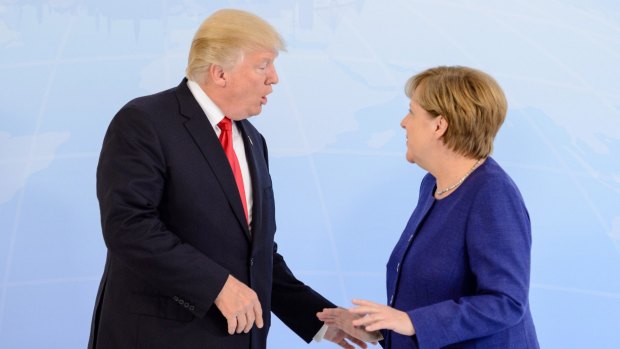 German Chancellor Angela Merkel receives US President Donald Trump in the Hotel Atlantic, on the eve of the G20 summit, for bilateral talks.
