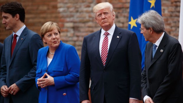 G7 leaders at Friday's meeting: Canadian Prime Minister Justin Trudeau, German Chancellor Angela Merkel, President Donald Trump, and Italian Prime Minister Paolo Gentiloni.