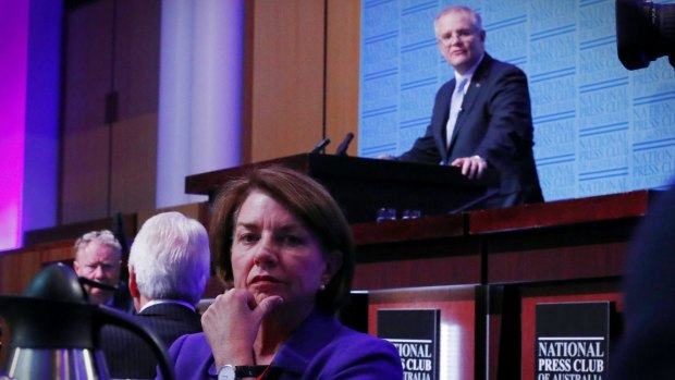 Australian Bankers' Association chief executive Anna Bligh listens as Treasurer Scott Morrison delivers his post-budget address in the Great Hall at Parliament House in Canberra. 