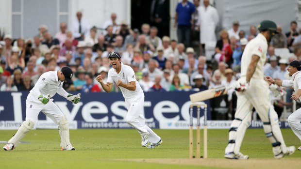 Another nick to the slips: Alastair Cook rejoices after taking an edge offered by Mitchell Johnson.