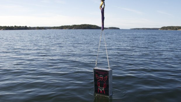 Meant to repel homophobic Russians ... The Singing Sailor, a waterproof box with a neon sign of a sailor in his underpants and the Russian message 'Welcome to Sweden - Gay since 1944', is lowered into the sea near Stockholm.
