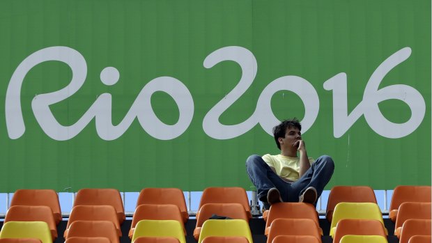It was not clear which athlete the man was posing as at the Olympics, officials say. 