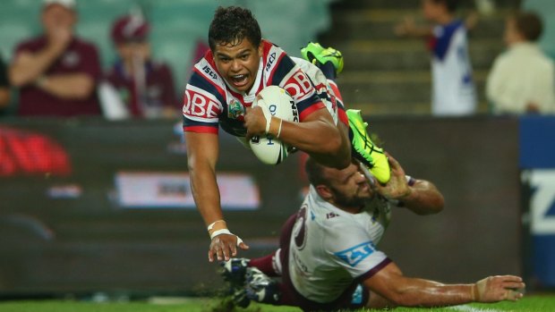 Flying high: Latrell Mitchell scores against Manly at the Roosters' home ground.