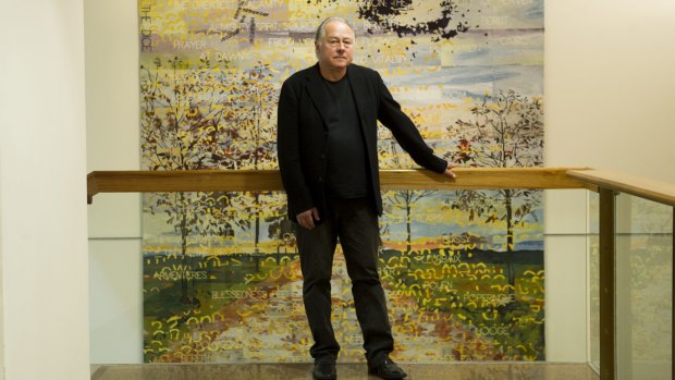 Artist Imants Tillers with the completed tapestry.