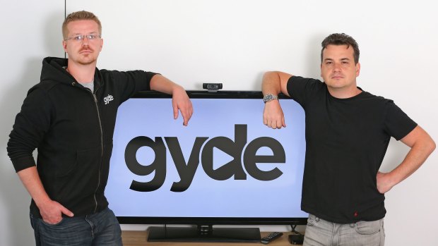 Tech entrepreneurs Scott Julian (R) and his brother Andrew Julian have developed an app called Gyde, a search engine for multiple TV streaming services.
