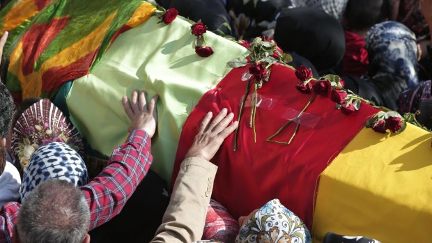 Mourners carry the coffin of a victim of Saturday's Ankara bombing attacks at a funeral in Istanbul on Monday.