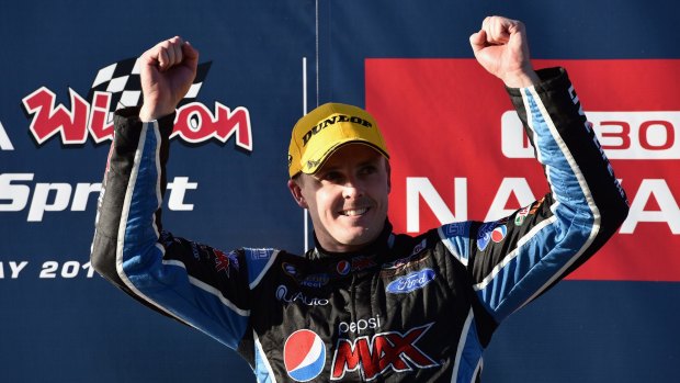 Mark Winterbottom on the podium after his win on Sunday.