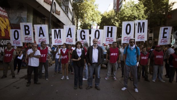Demonstrators protest against the visit by President Barack Obama, near the US Embassy in Buenos Aires. Human rights activists argue that during the Cold War, the US backed military dictatorships, including Argentina's regime.