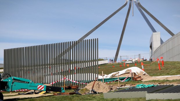 A security fence is installed across the lawns of Parliament House in Canberra on Tuesday.