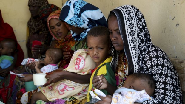 Mothers feed their children at a health post in Dubti, Ethiopia, earlier this month.