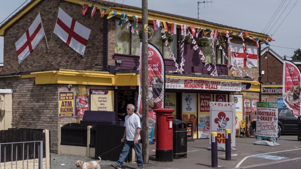 Flags of England and other nations competing in the UEFA European Championship decorate a convenience store in Canvey Island, England, June 10, 2016. 
