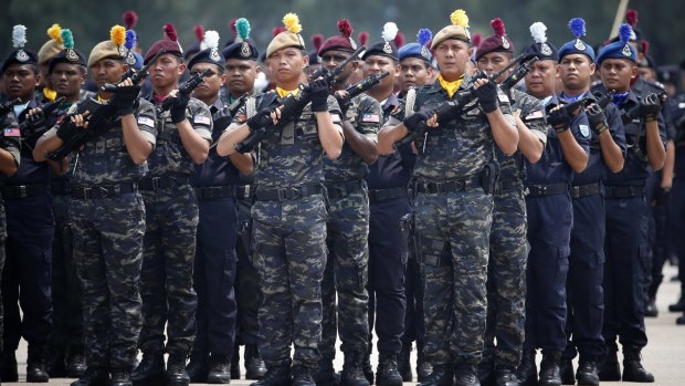 Malaysia's police special-unit members stand in formation in Kuala Lumpur in March.  