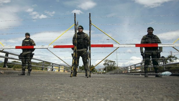 Colombian soldiers stand guard at Simon Bolivar international bridge, on the border with Venezuela.