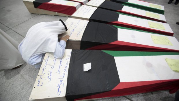 The coffins of victims of the bombing at the Imam Sadeq mosque in Kuwait City.