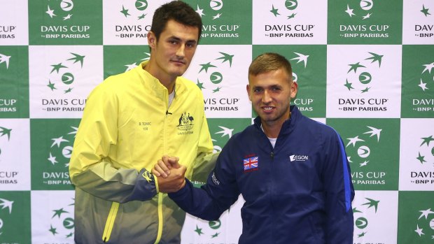 David v Goliath: Dan Evans poses for a photo with Bernard Tomic at Emirates Arena in Glasgow.