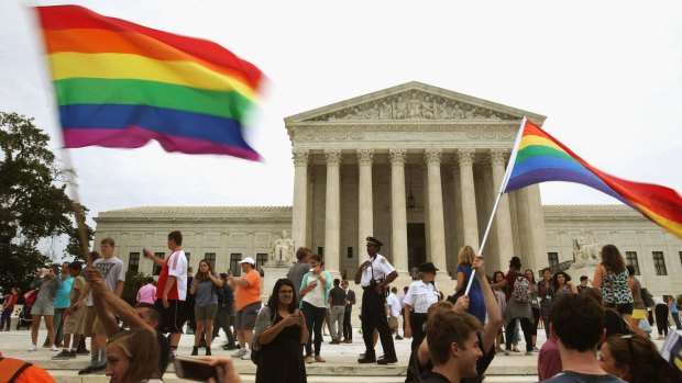 Supporters of marriage equality gather in front of the US Supreme Court, which ruled on Friday that same-sex couples have the right to marry in all states.