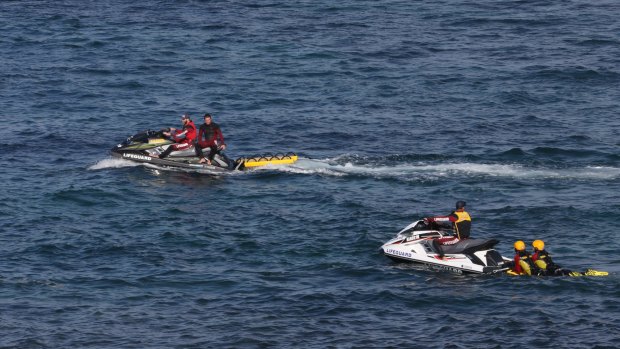 Jet-skis search waters off Botany for Tim Nguyen.