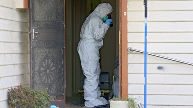 Forensics police search the Pascoe Vale house.