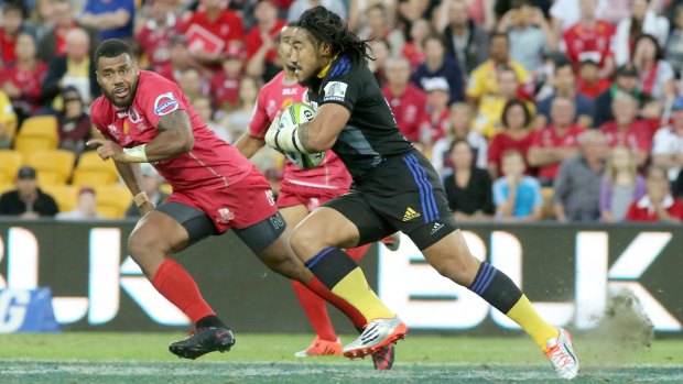 Samu Kerevi of Reds in defence against Ma'a Nonu of the Hurricanesat Suncorp Stadium.
