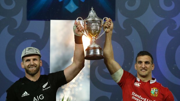Extraordinary: New Zealand captain Kieran Read, left. and Lions captain Sam Warburton share the spoils after an epic three-Test series.