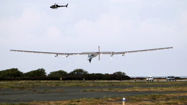 The Solar Impulse 2 airplane, piloted by Andre Borschberg, lands at Kalaeloa Airport in Kapolei, Hawaii.