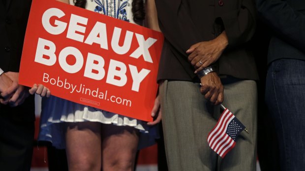 People on stage hold a sign using the Louisiana word for "go" as Bobby Jindal announces his candidacy.