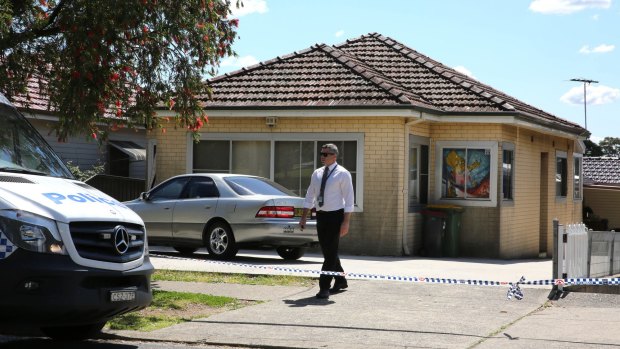 Police at the crime scene in Bass Hill after a man's body was found
