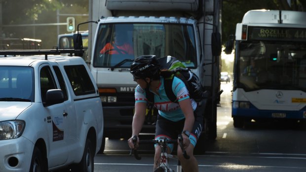 Cyclists in early morning CBD traffic in Sydney.