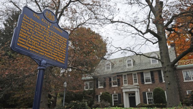 A blue state historical marker sits outside Grace Kelly's childhood home in Philadelphia. She accepted the marriage proposal of Prince Rainier III of Monaco there in 1955.