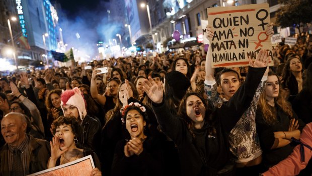 Demonstrators take part in a march demanding women's rights and marking International Women's Day in Madrid, Spain.