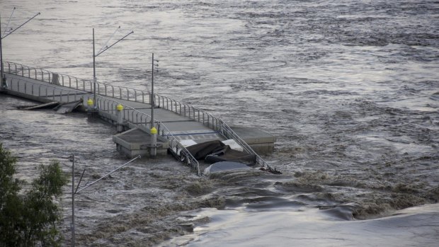 The Riverwalk floats down the Brisbane River during the floods.