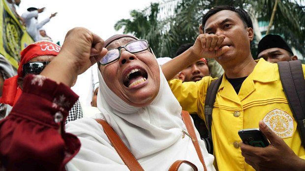 Anti-Ahok protester expresses her distress after he was jailed for two years rather than the maximum of five.