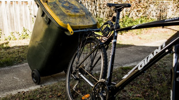 Andrew Jenson used rope to tie the bin's handles to the rack on the back of his bike.

The Canberra Times

Photo Jamila Toderas