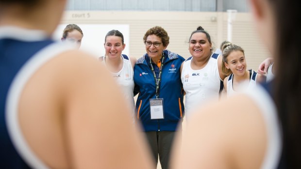 Marcia Ella-Duncan with players at an Indigenous netball high performance camp.